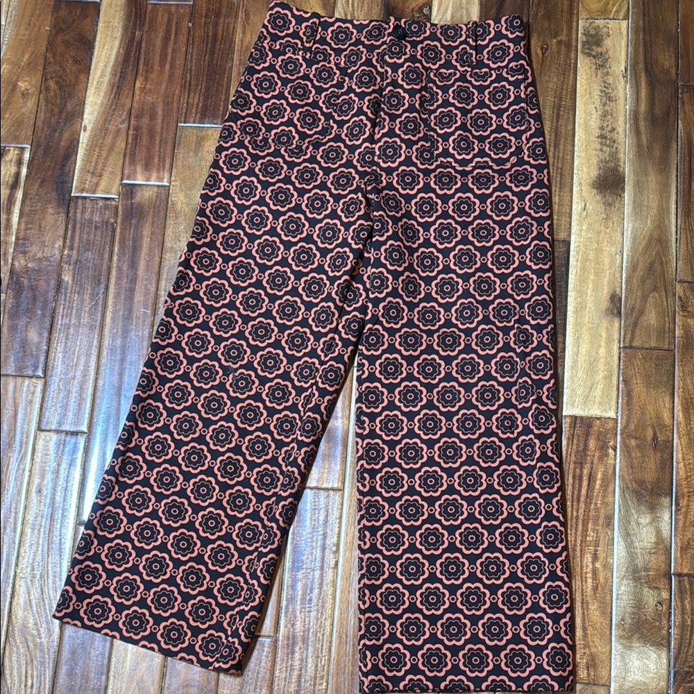 Anthropologie Black and Orange Patterned Flare Pants